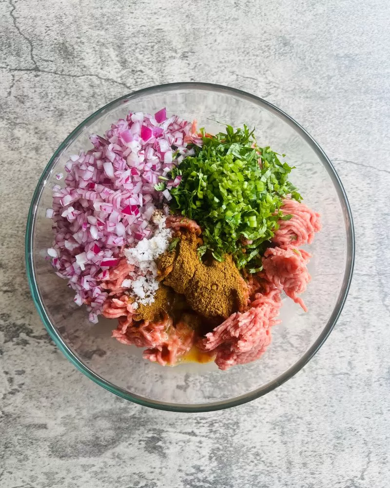 meatball mixture in a glass bowl