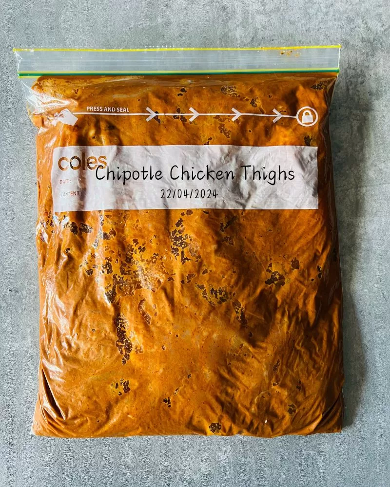 zip lock bag with marinating chipotle chicken 