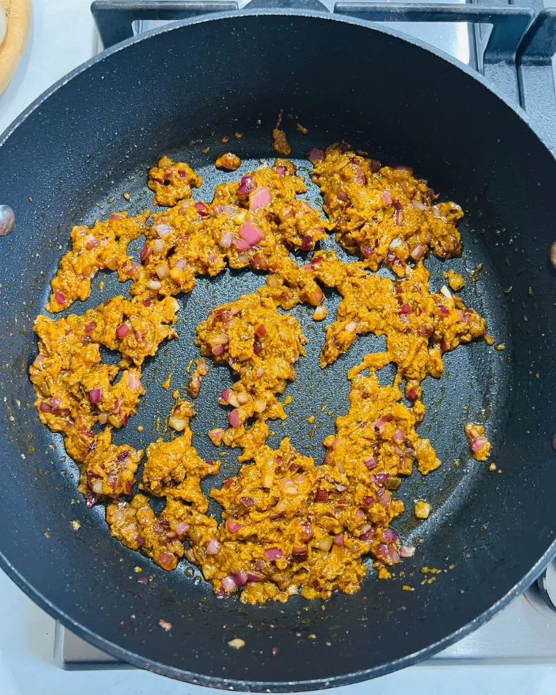 onion and spice mix cooking in pan