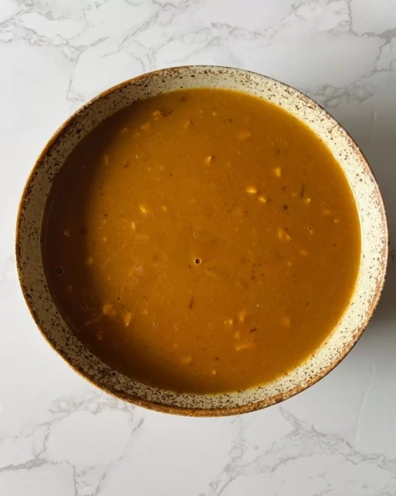 bowl of satay sauce on marble background