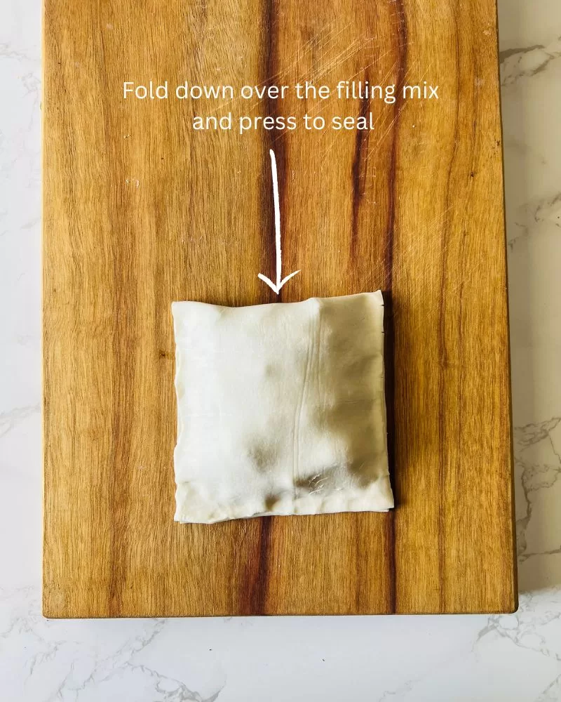 square puff pastry pocket on wood board