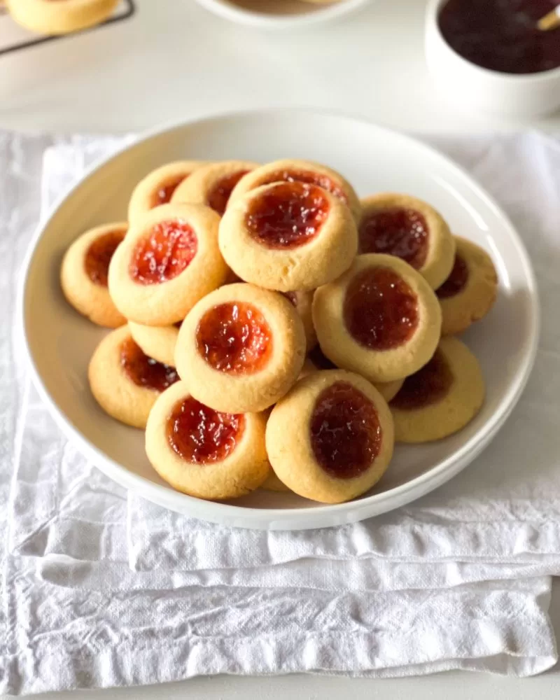 plate piled up with mini jam drop biscuits