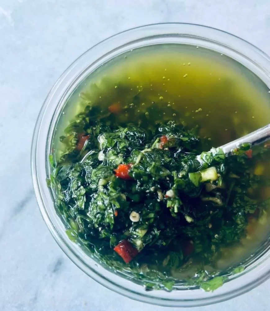Chimichurri in glass jar with spoon