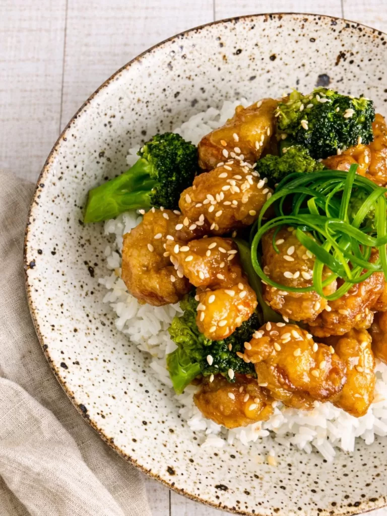 Close-up of crispy lemon honey chicken showing crunchy golden coating