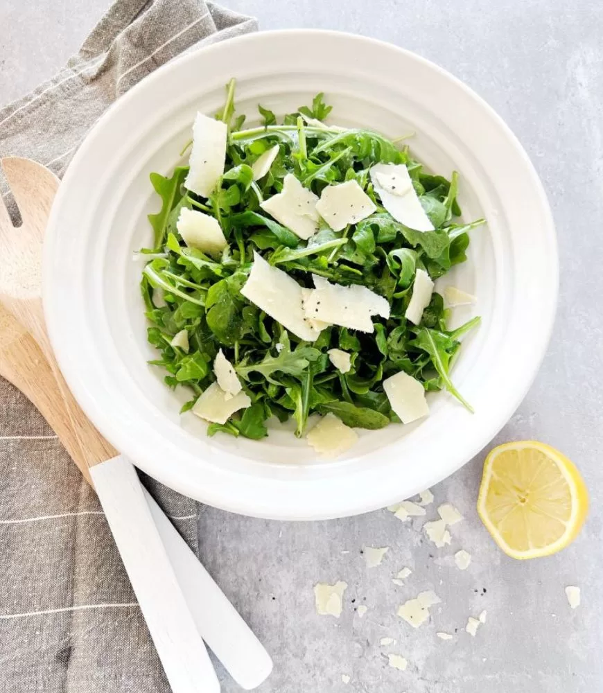 rocket and parmesan salad in white bowl