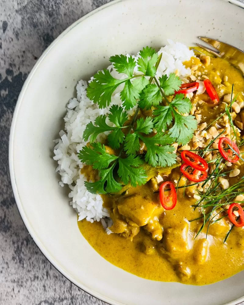 satay chicken curry in bowl with rice