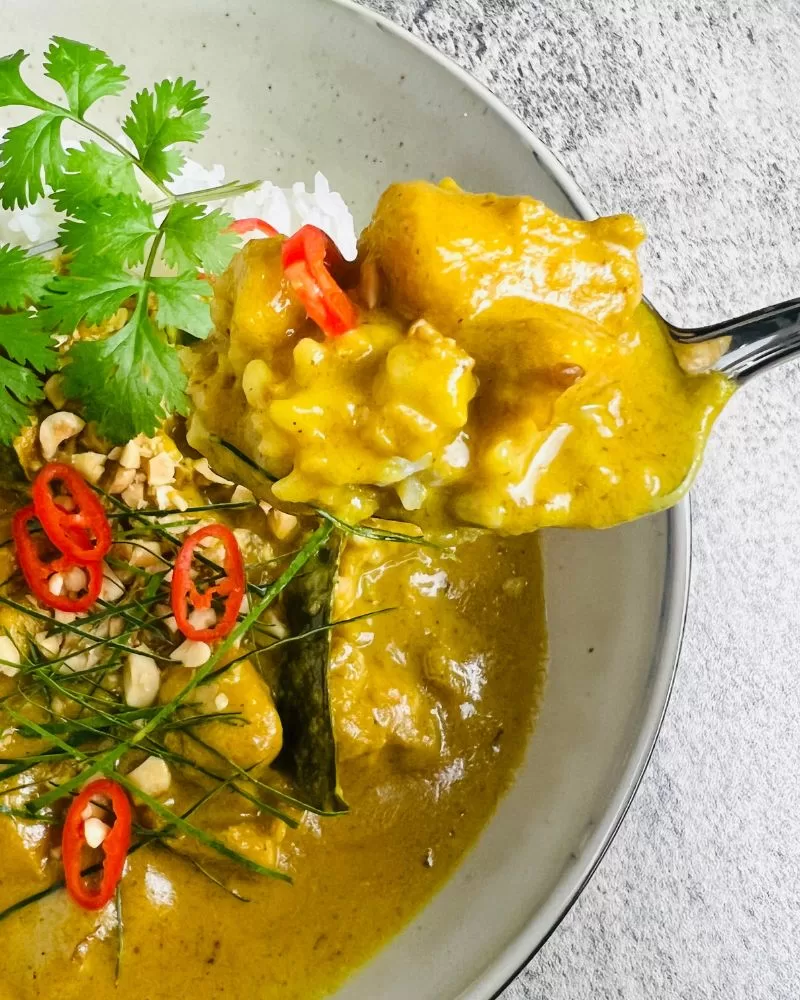 satay chicken curry in bowl with rice