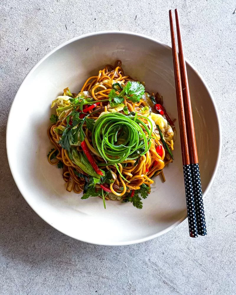 noodles in a bowl with chopsticks