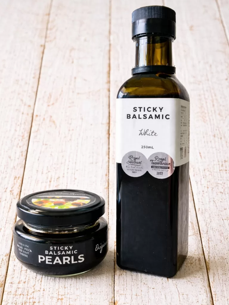 bottle of sticky balsamic and small jar of sticky balsamic pearls