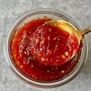 chilli jam in glass jar with spoon