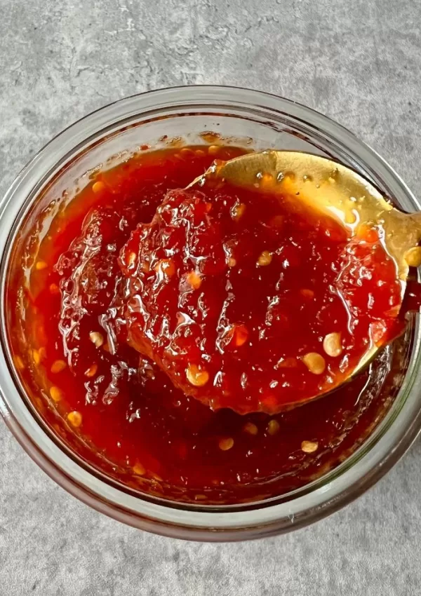 chilli jam in glass jar with spoon