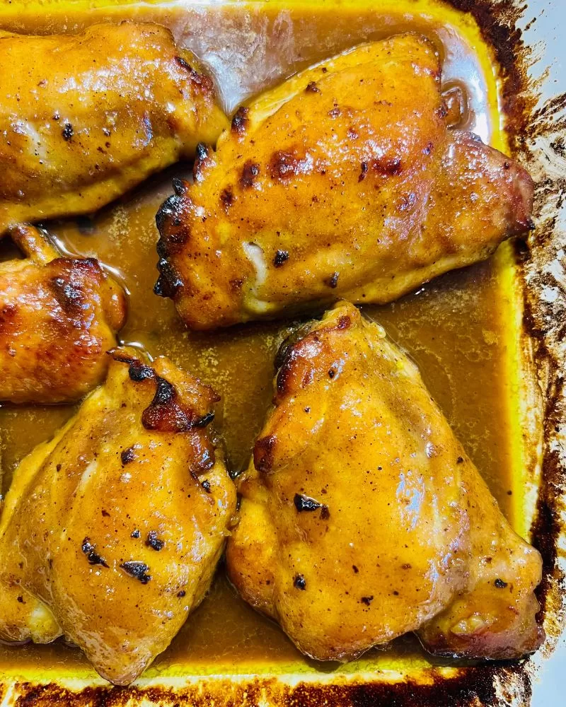 curried honey chicken cooked in baking dish