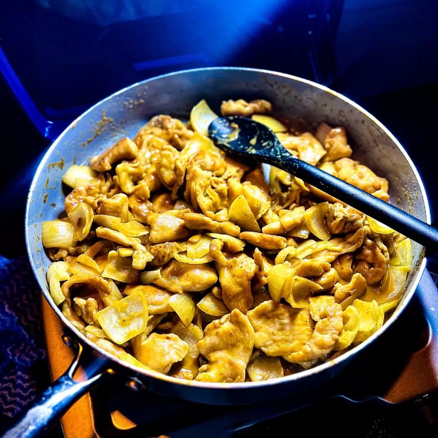satay chicken stir fry in a pan