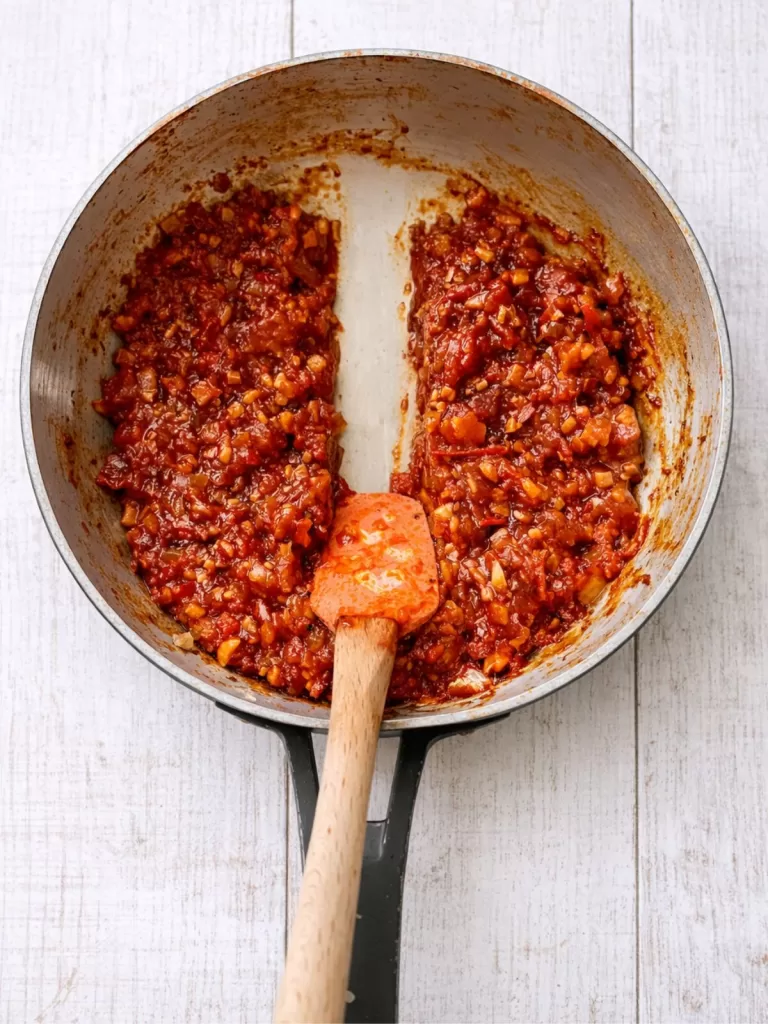 showing the Tomato bacon and chilli jam consistency in a saucepan