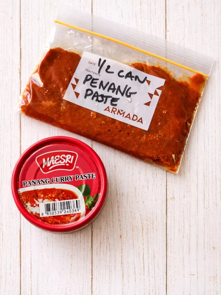 Can of Maesri brand Panang Curry paste with some extra curry paste in a zip-lock bag.