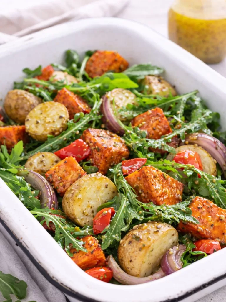 Oven-roasted vegetables with baby potatoes, sweet potato, red capsicum and red onion tossed with fresh rocket and lightly coated in honey mustard dressing.