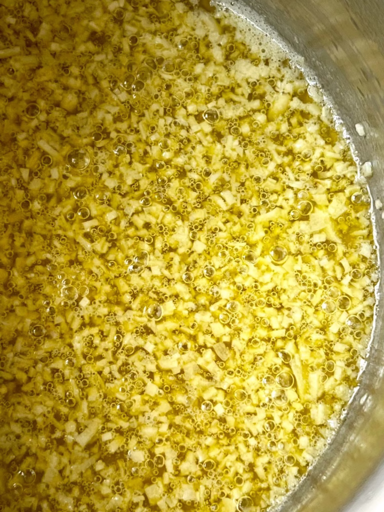 garlic cooking in butter in a saucepan